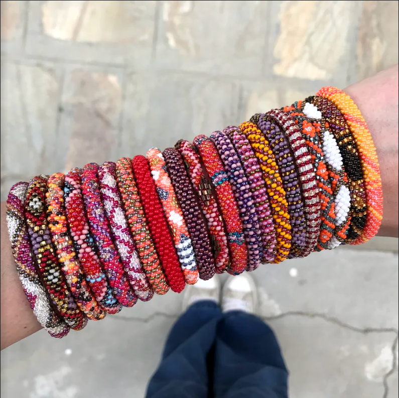 AID THROUGH TRADE ROLL ON BRACELETS